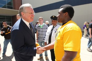 Missouri Governor Jay Nixon congratulates Luther Banner, winner of the FIRST Robotic Competition