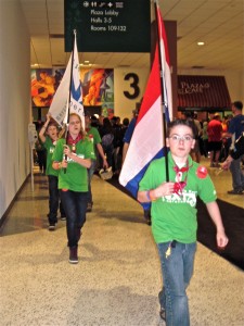 A typical robotics team carries their flag at the FIRST competition